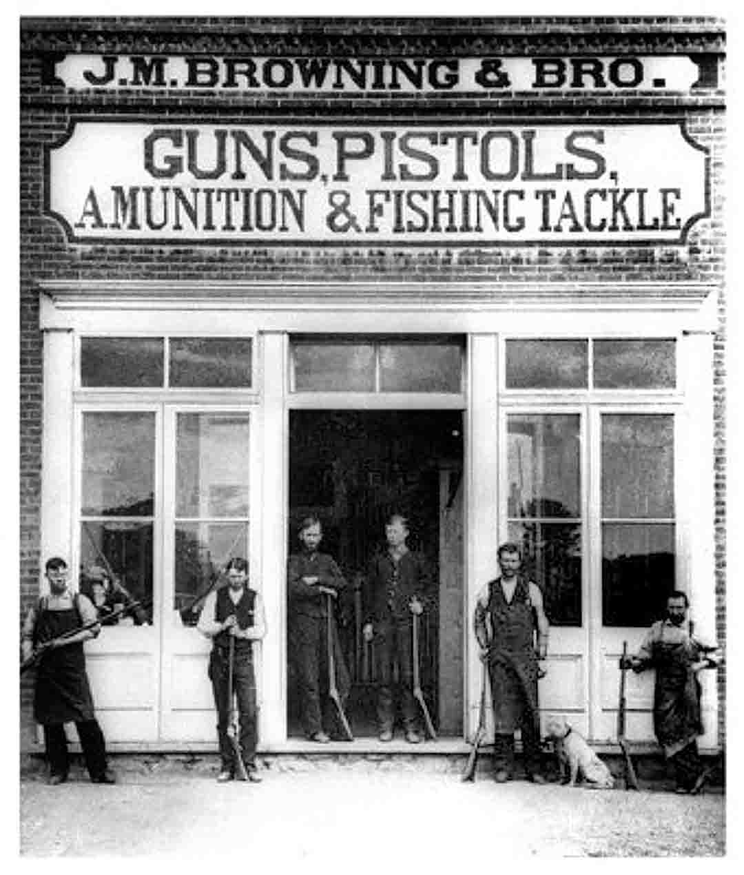 The Browning store in Utah. Workman are out showing their wares all dressed for a day’s work. Note the sign with the misspelling of “ammunition.”